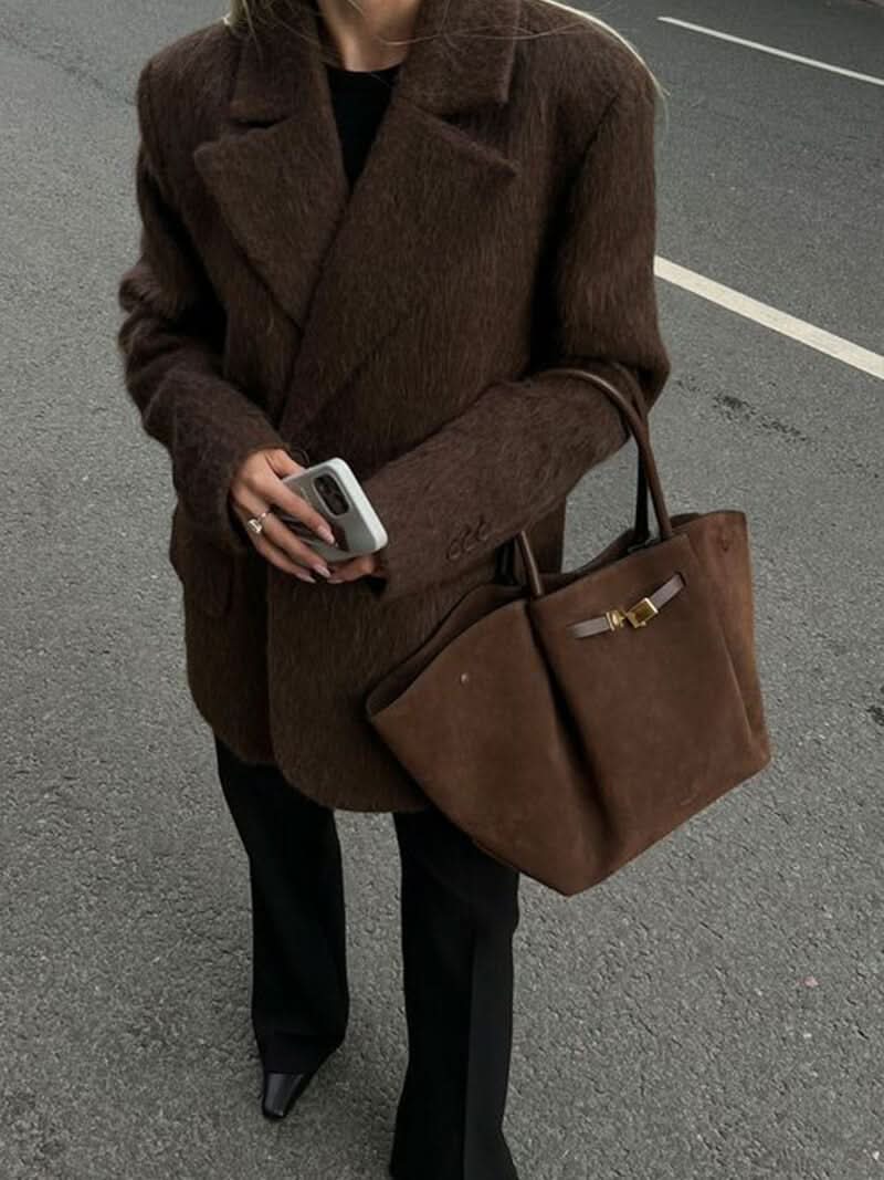 Handtasche mit Tragegriffen und Schulterriemen